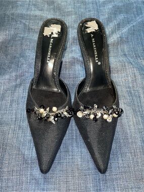 A. Marinelli black pointed-toe mules with shell charm